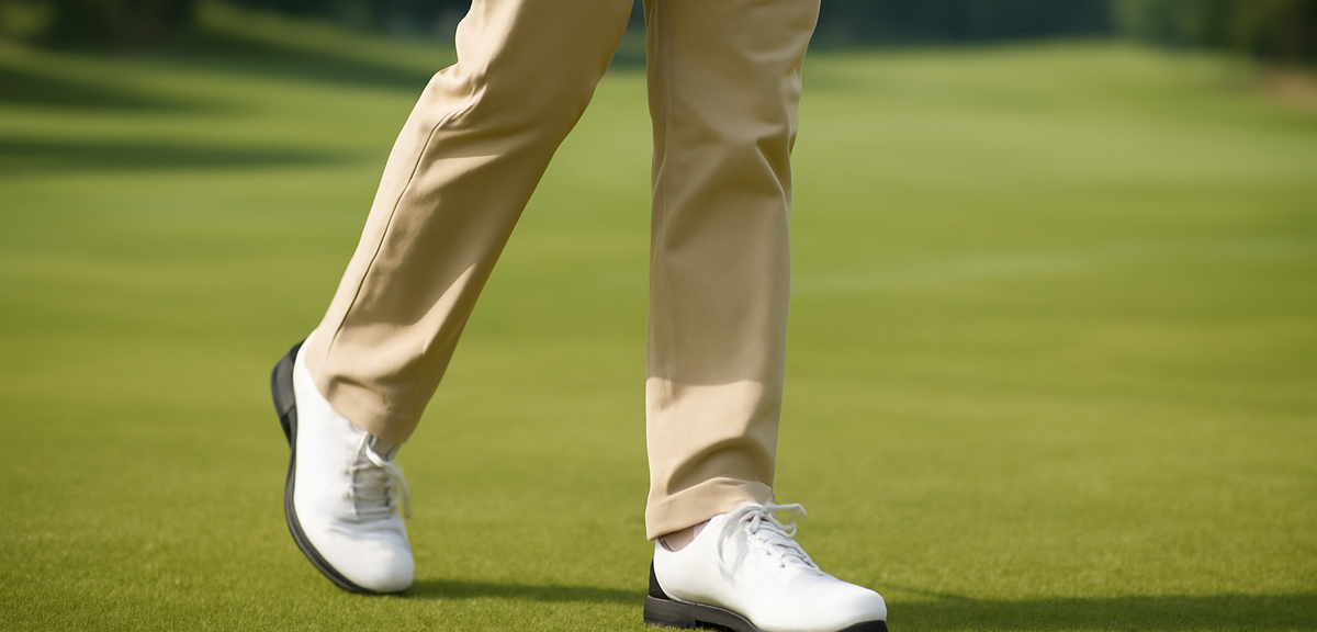 Golfer walking on a fairway seen from the knees down with golf shoes on grass, photorealistic, no te