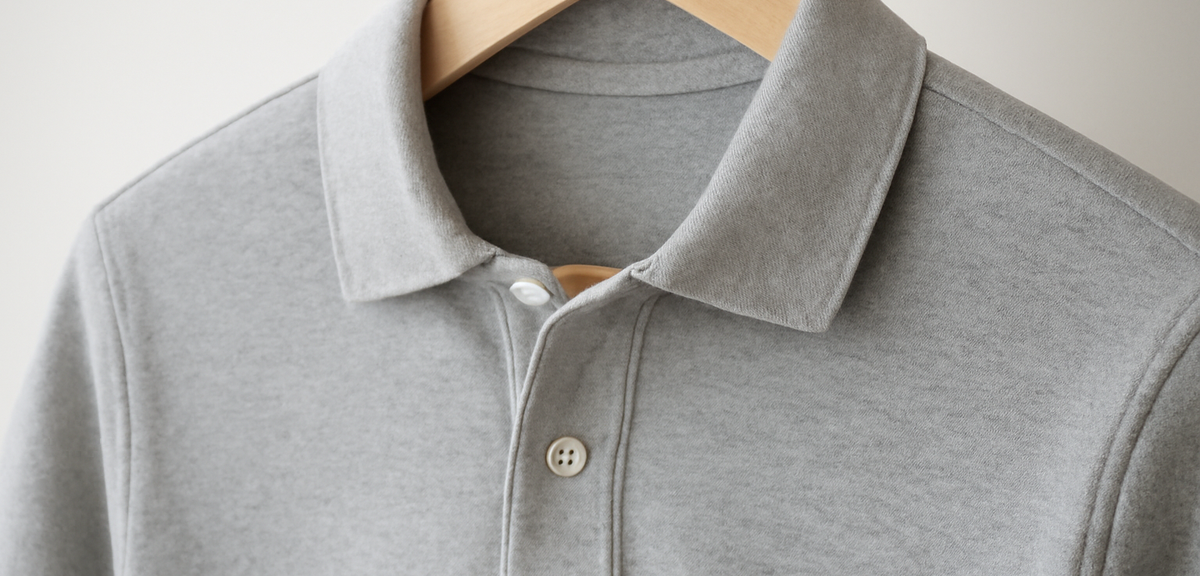 Close-up of a polo shirt collar and placket on a hanger, photorealistic, no text